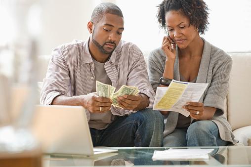 Young couple reviewing their finances.